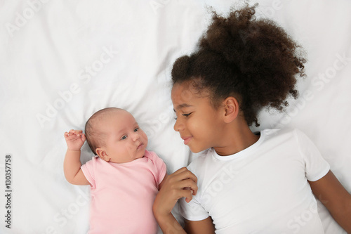 Cute baby and elder sister ...