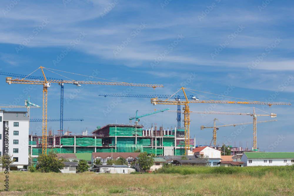 Industrial construction crane with sky background