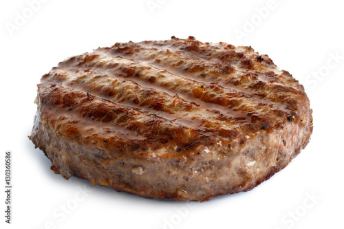Single grilled hamburger patty isolated on white.