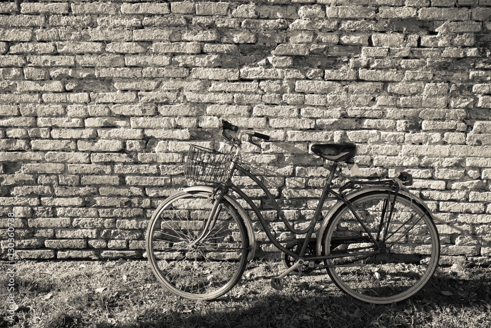 old bicycle parked long an external wall in Burano island, Venice old bicycle parked long an external wall in Burano island, Venice