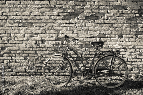 old bicycle parked long an external wall in Burano island, Venice