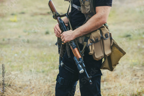 Soldier with a gun in the hands of the patrol area.