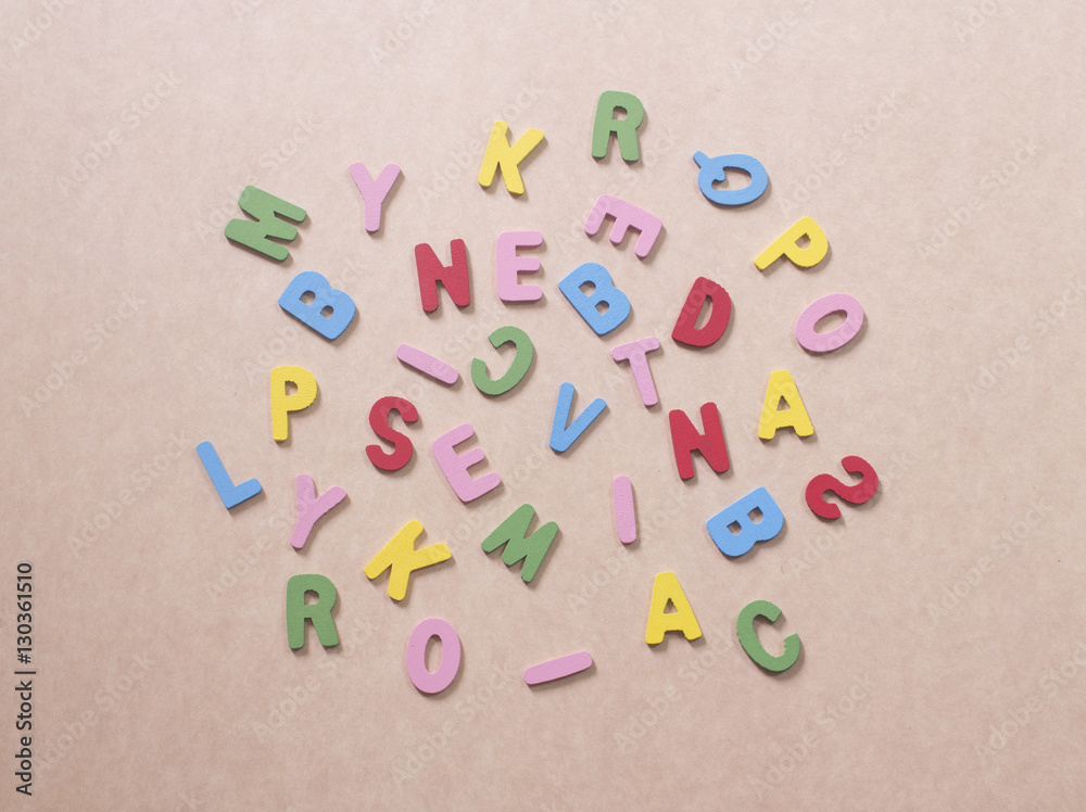 colorful alphabets on brown paper colorful alphabets on brown paper