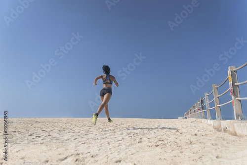 Fit Girl jogging on Sand 