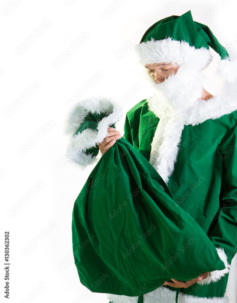 Santa Claus in a green suit with bag Stock Photo | Adobe Stock