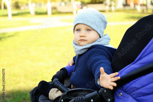 Cute little baby sitting in...
