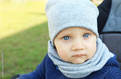 Cute little baby sitting in...
