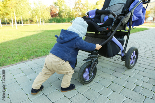 Cute little baby pushing vi...