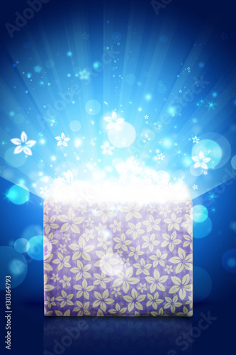 Open magic gift box with bright light