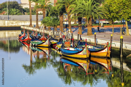 Gondola-like moliceiros boats anchored along the Central Channel, Aveiro, Beira, Portugal photo