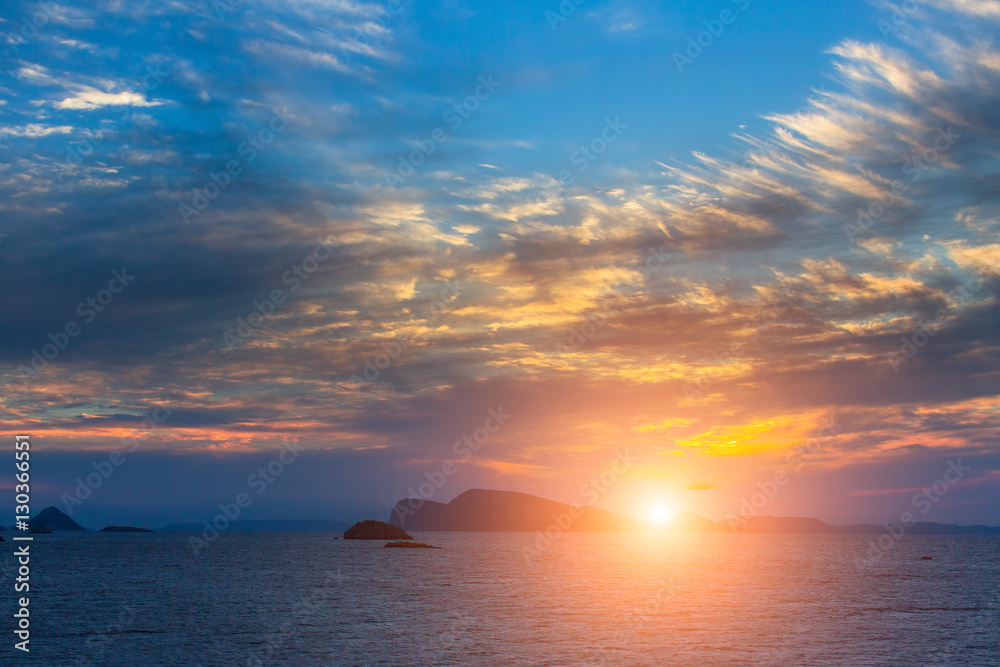 Stunning sunset among Islands in the Aegean sea.