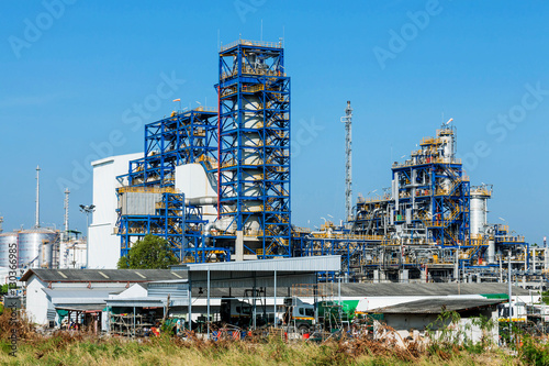 Petrochemical plant, oil refinery factory with cloudy sky