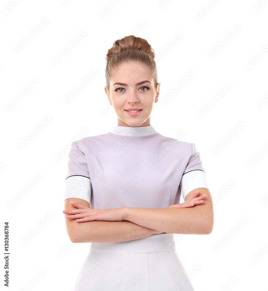 Portrait of beautiful chambermaid with crossed hands isolated on white