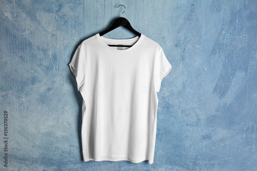 Blank white t-shirt on grunge background Blank white t-shirt on grunge background
