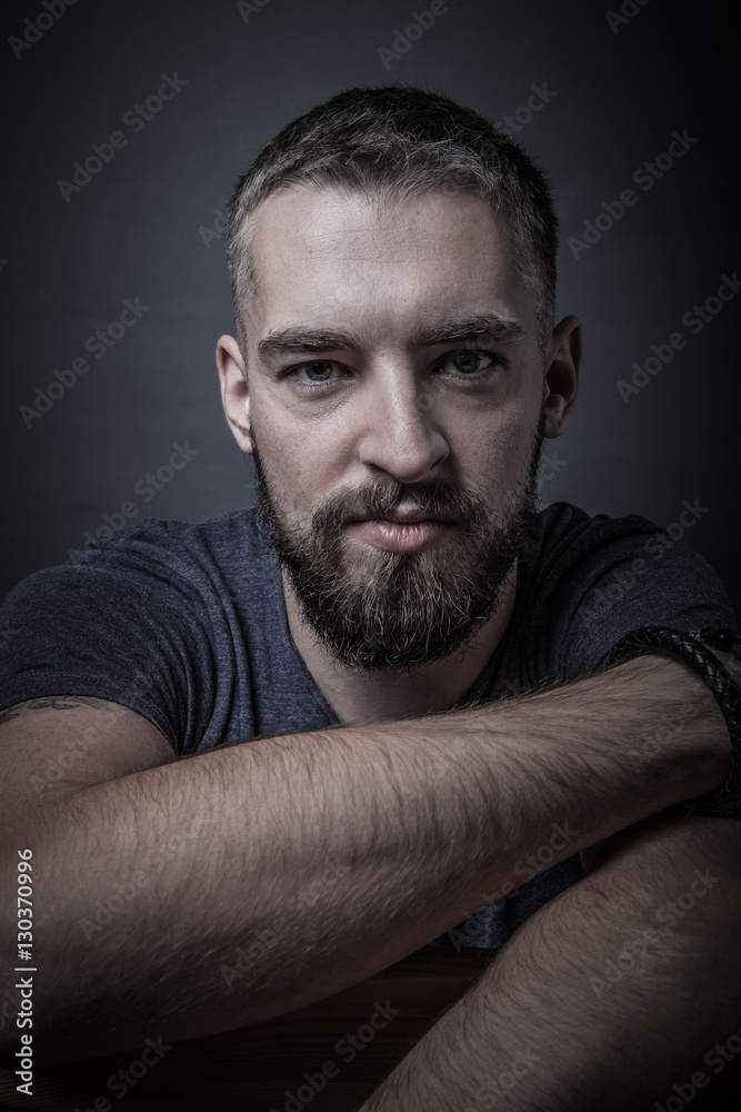 Portrait of a young man with a beard. Toned Portrait of a young man with a beard. Toned