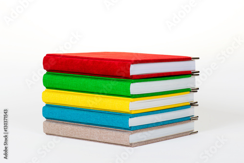 Wallpaper Mural Multicolored book textile cover. Photobooks on a white background. Torontodigital.ca