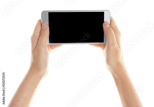 Hands holding cellphone on white background