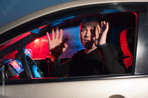 Young driver with alcohol surrendering to police