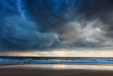 Gathering storm on beach