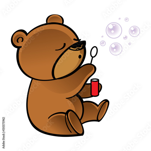 Funny little bear blowing bubbles in the air
