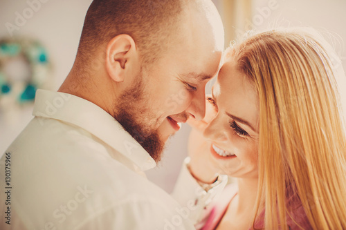 Portrait of happy young couple looking at each other and smiling