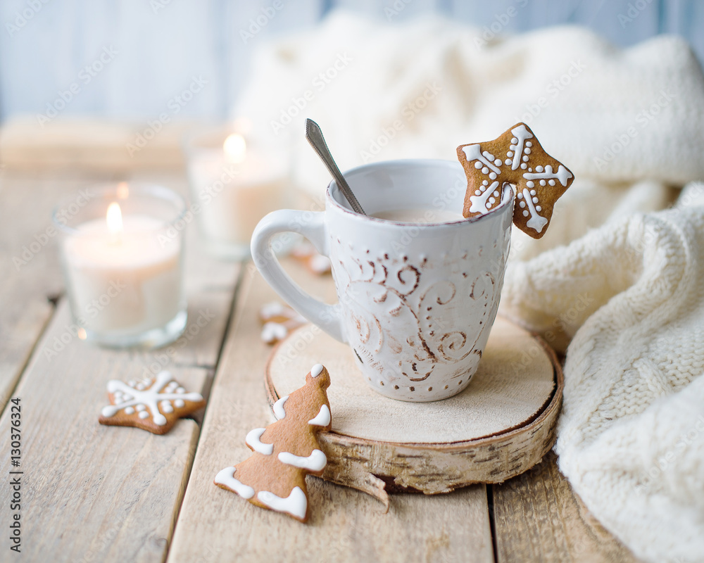 Cup of hot chocolate with gingerbread and candle. Cup of hot chocolate with gingerbread and candle.