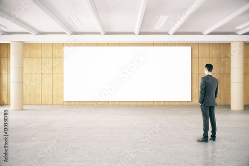 Man looking at empty poster