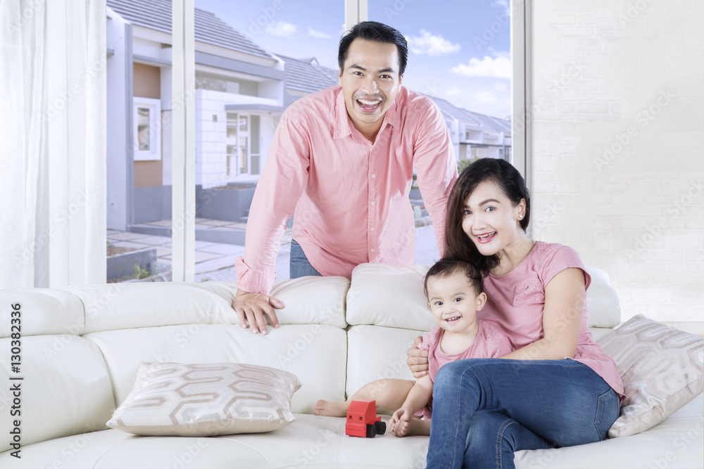 Cute daughter plays toy with parents Cute daughter plays toy with parents