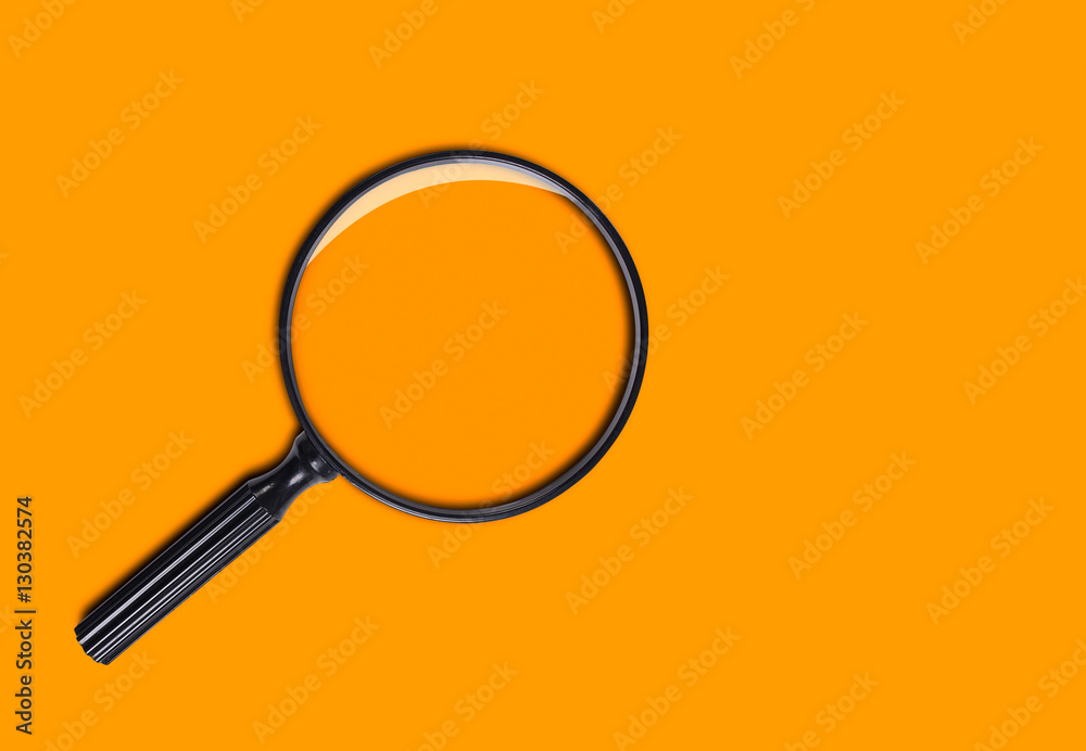 Magnifying Glass, Isolated on orange Background Magnifying Glass, Isolated on orange Background