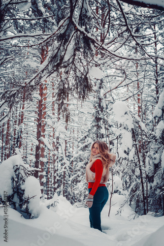 Fototapeta Naklejka Na Ścianę i Meble -  Photo charming naughty girl outdoors in winter with snow action game