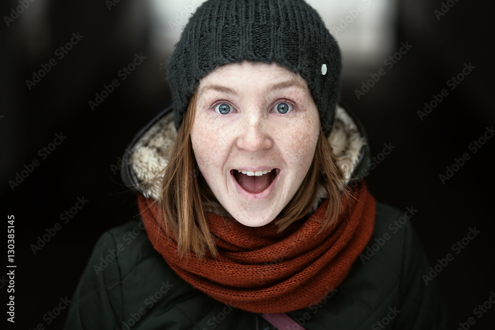 playful woman in knitted winter cap smiling playful woman in knitted winter cap smiling
