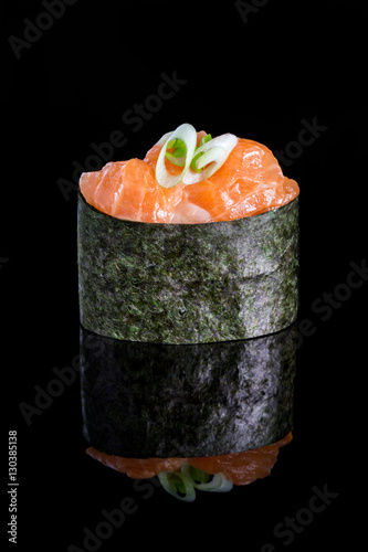 Gunkan maki sushi with salmon isolated on black background