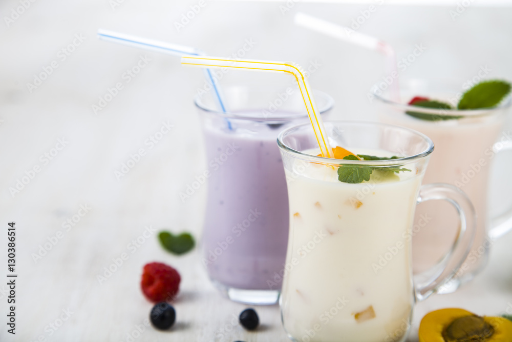 Smoothies or yogurt with fresh berries. Milkshakes with raspberr Smoothies or yogurt with fresh berries. Milkshakes with raspberr