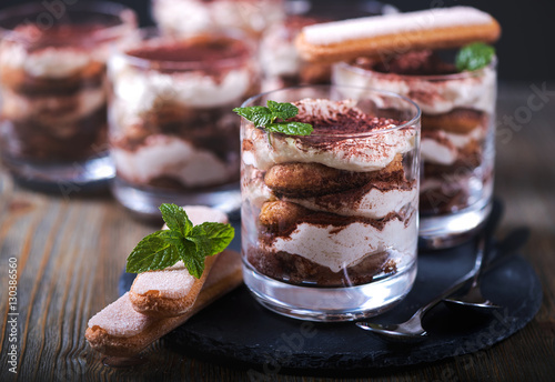 Italian dessert tiramisu in glass, sweet food