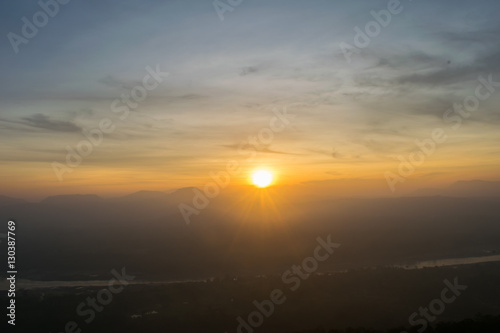 the rising sun with colorful misty morning in rocks