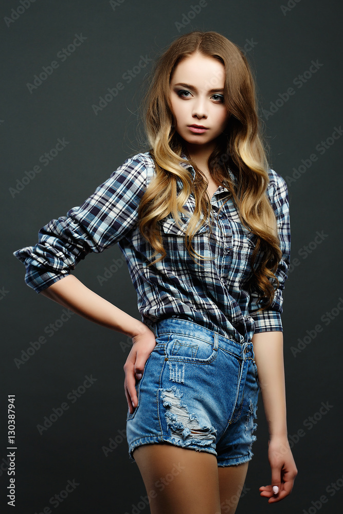 Girl with long hair dressed in American style