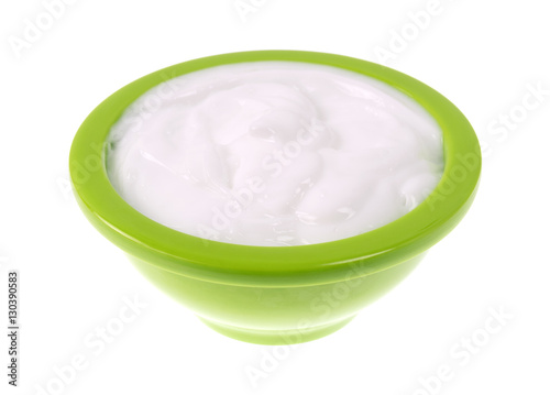 Bowl of vitamin E lotion on a white background