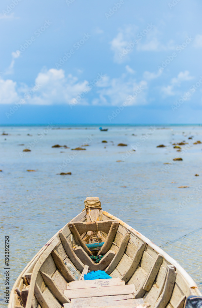 Wooden fishing boats moored at sea.