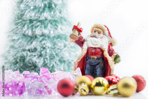 santa claus red and gold ball and blur tree background