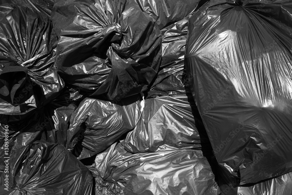 A pile of black garbage bags.