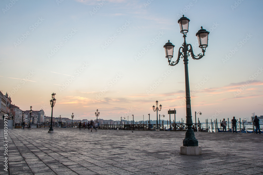 Traditional Venetian street light at sunrise. Venice, Italy.