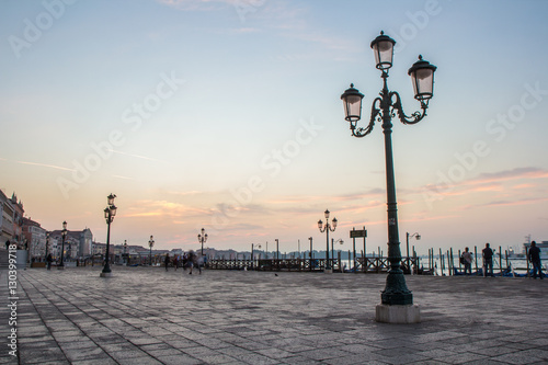 Traditional Venetian street light at sunrise. Venice, Italy.