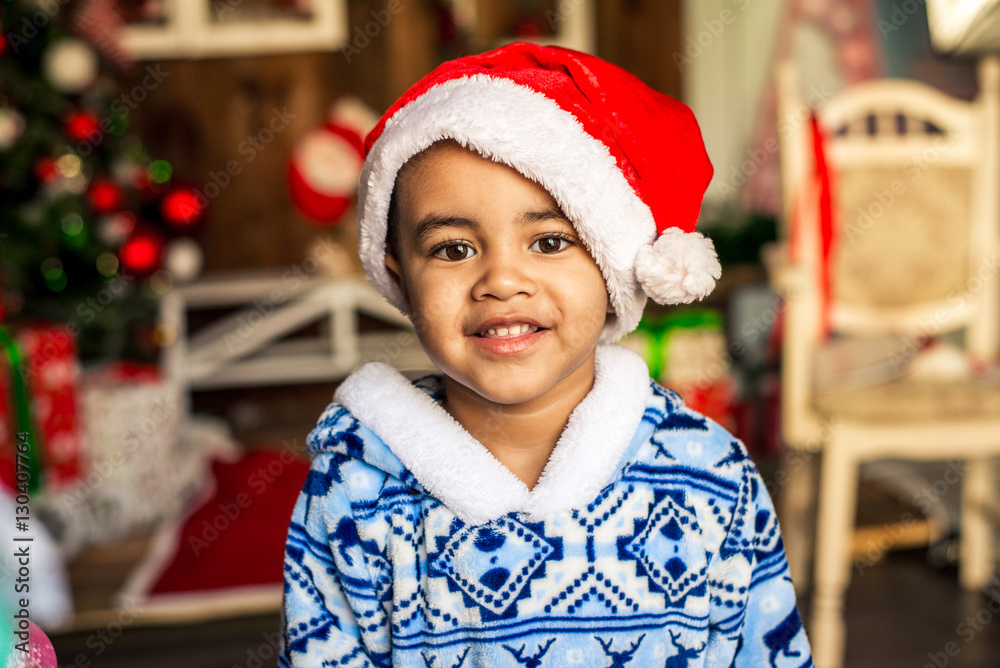 Happy little boy in a cap of Santa Claus Happy little boy in a cap of Santa Claus