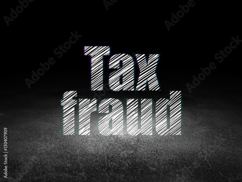 Law concept: Tax Fraud in grunge dark room photo