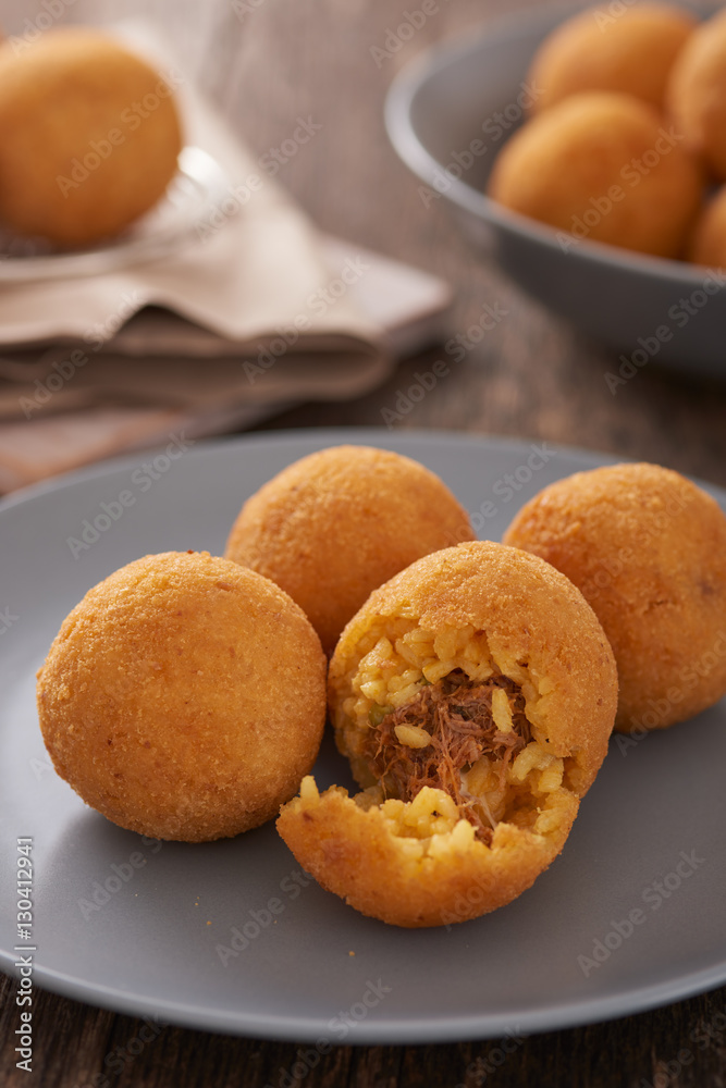 Arancini (deep fried rice balls with meat) Typical Sicilian street food Arancini (deep fried rice balls with meat) Typical Sicilian street food