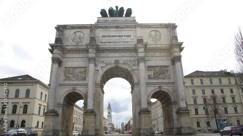 Triumphal arch crowned with statue of Bavaria and lions in Munich, Germany photo