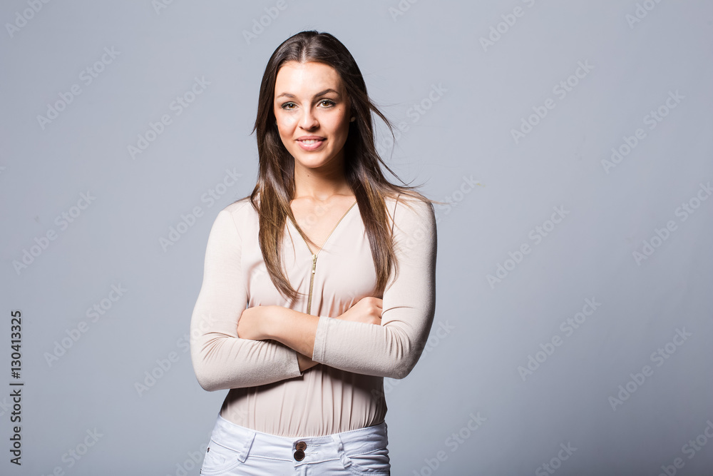 Young brunette business woman looking professional in a studio