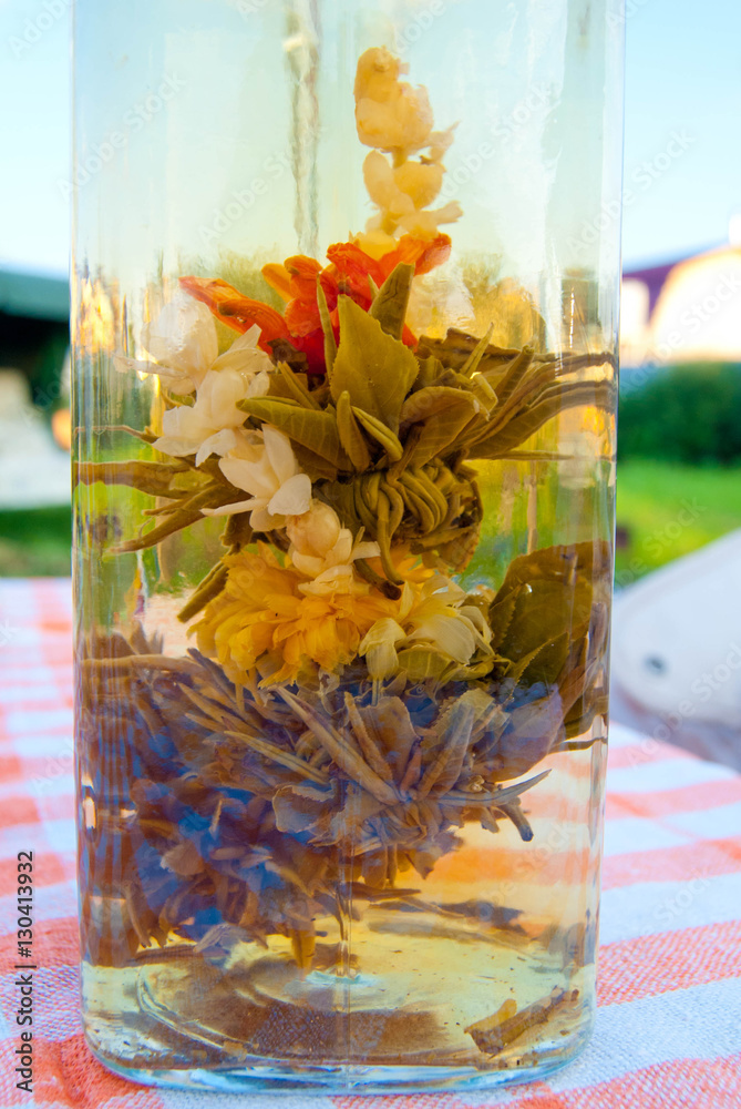 Chinees Opened flower tea freshly brewed at transparent teapot