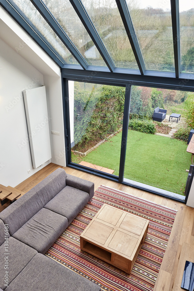 Fototapeta premium Modern living room with large windows