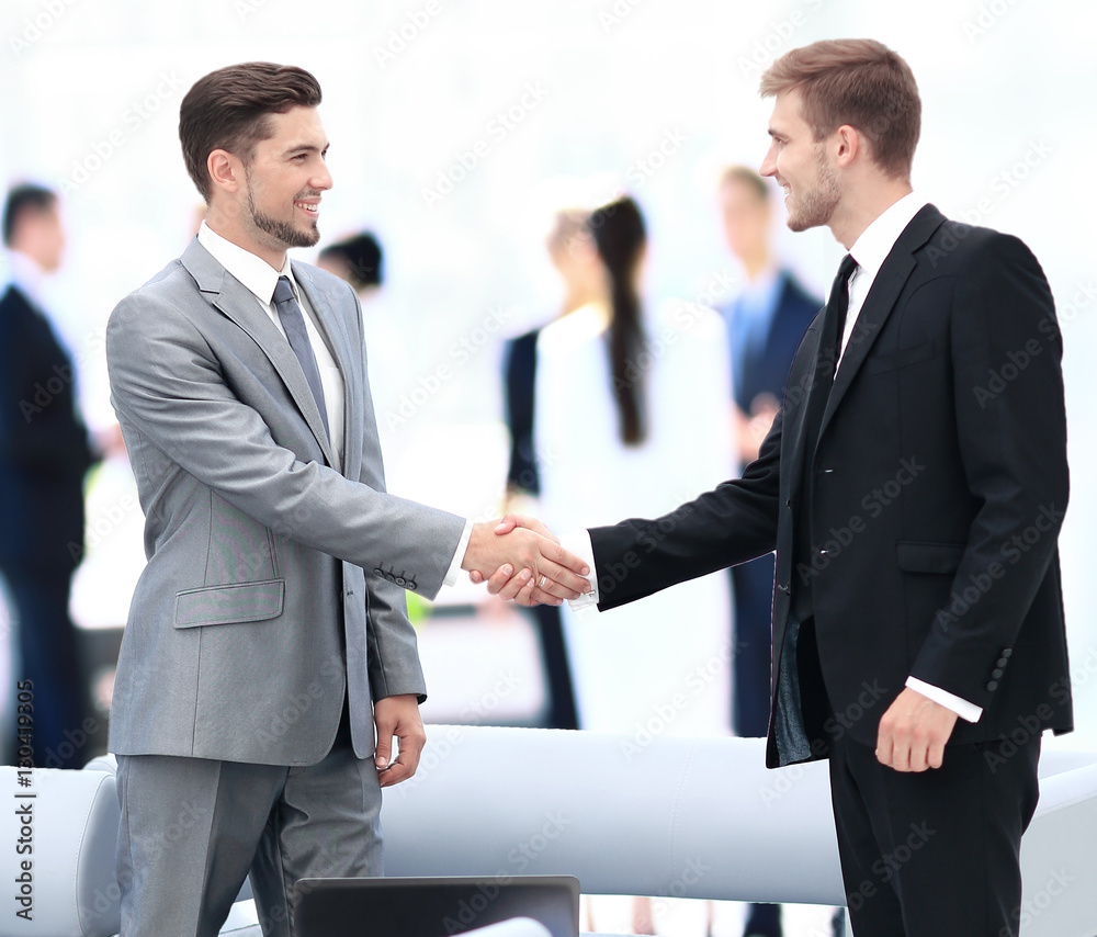 Business people shaking hands during a meeting Business people shaking hands during a meeting